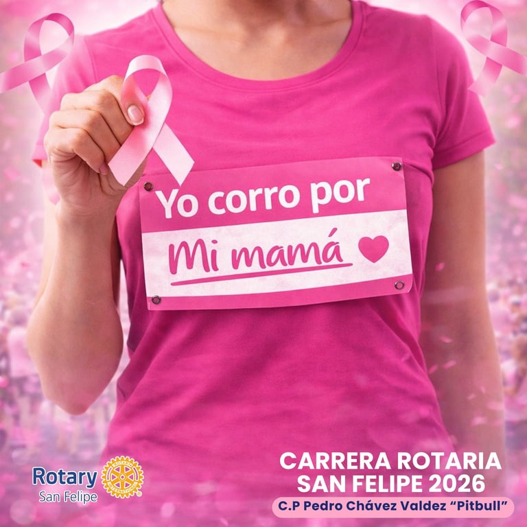 Person wearing pink breast cancer awareness shirt holding pink ribbon, supporting a race for mothers, Rotary San Felipe 2026